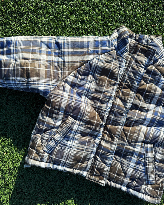 Kids padded winter plaid jacket on grass